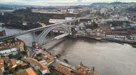 Porto, Portugal - 12.25.2022: Aerial view of the old city and the Don Luis bridge in Porto. High quality photo