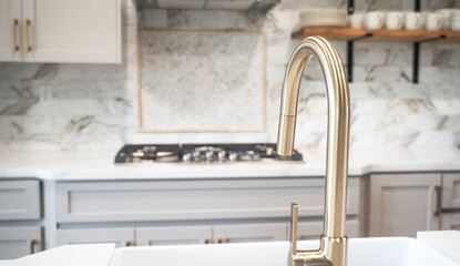 Newly remodeled kitchen with gold faucet