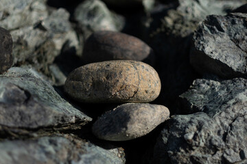 Fototapeta na wymiar Rocks stacked up at the beach, reflecting moments of tranquility in a natural setting.