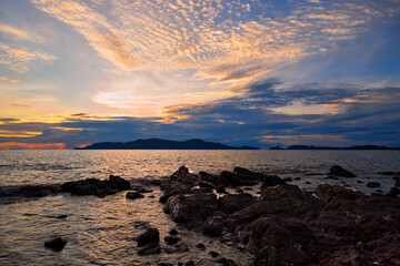 Sunset over the sea with dramatic sky