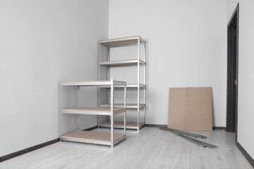 Office room with white walls and metal storage shelves