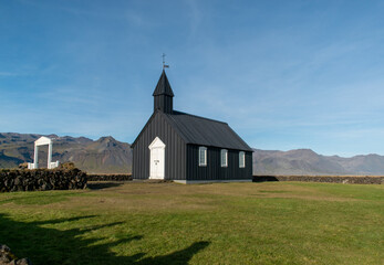 Fototapeta na wymiar Búðakirkja church on a sunny day, Búðir, Iceland