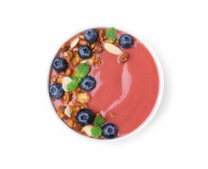 Bowl of delicious smoothie with fresh blueberries and granola isolated on white, top view