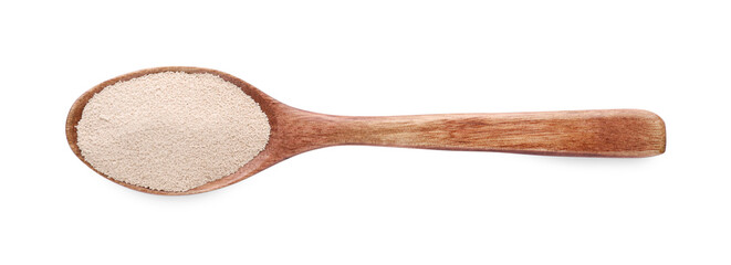 Spoon with active dry yeast isolated on white, top view