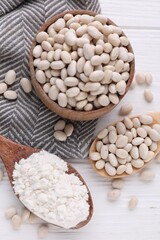 Kidney bean flour and seeds on white wooden table, flat lay