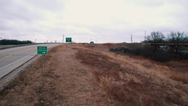 Wigh Station road sign that indicates is open. Semi Trucks needs to pull over for inspection. Wisconsin USA 4k
