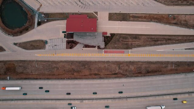 top down above highway and  Truck Weigh Station next to Interstate. Department of Trasportation place where they pull truck drivers for safety inspection. Scale for vehicles. Wisconsin, USA 4k