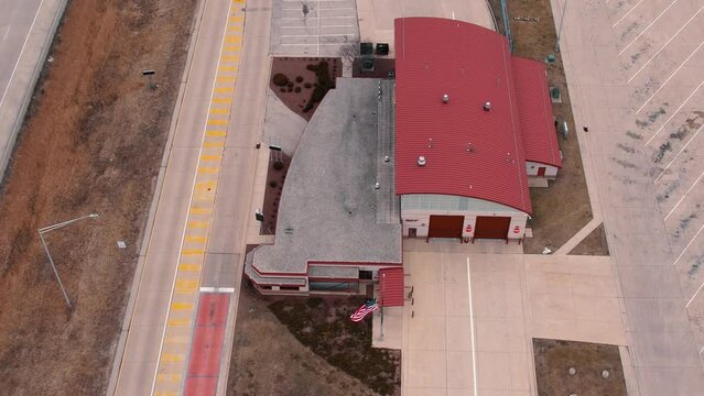 Empty weigh station scale with american flag.  Department of Trasportation place where they pull truck drivers for safety inspection. Scale for vehicles. Wisconsin USA 4k