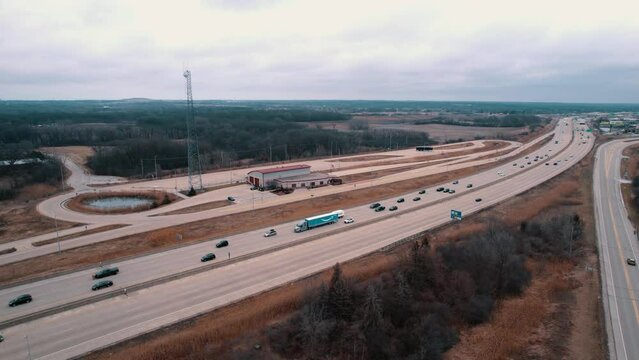rising aerial of Truck Weigh Station next to Interstate. Department of Trasportation place where they pull truck drivers for safety inspection. Scale for vehicles. Wisconsin, USA 4k