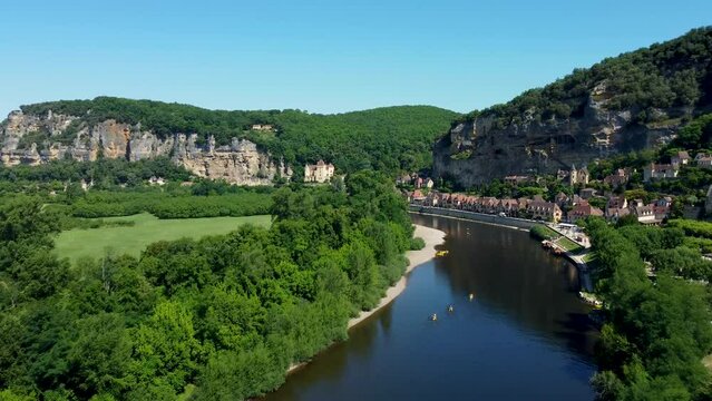 Smooth 4K footage heading up the river in La Roque-Gageac, which is is a commune in the Dordogne department in Nouvelle-Aquitaine, southwestern France.