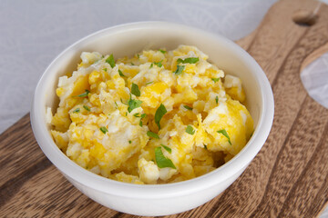 Wholesome Scrambled Eggs with Fresh Seasonings in Bowl