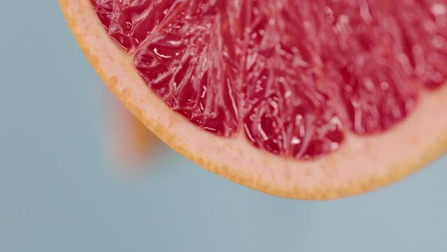 Vertical video of a close-up macro grapefruit for background