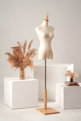 Vintage mannequin without hands on a light studio background