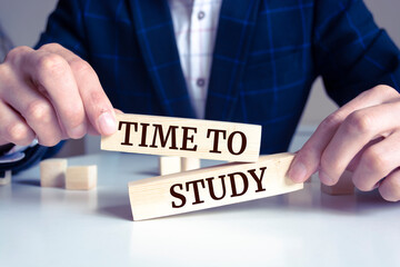 Close up on businessman holding a wooden block with 