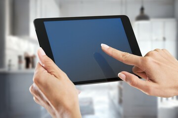 Human hand hold a digital tablet