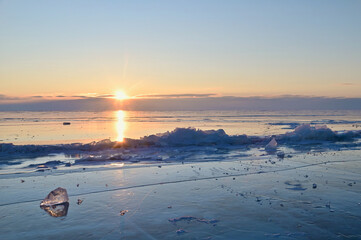 Sunrise Reflecting On  Ice Surface of Lake Baikal in Winter