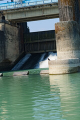 side view of river dam with road on top of the dam