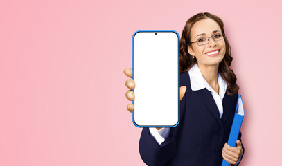 Portrait image of happy smiling woman in glasses, confident suit hold show smartphone cell phone...