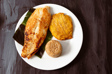 Tilapia fish fillet with rice and fried plantain