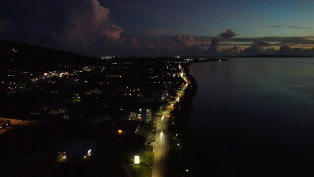 Aerial view of road along coastline at dusk