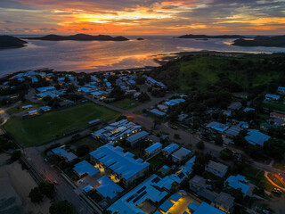 Aerial sunset showing the beach and town of Torres Strait, Thursday island