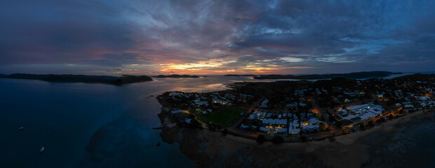 Aerial sunset panorama showing the beach and clear water of Torres Strait