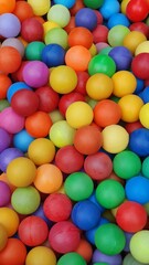 Fototapeta na wymiar vertical image of a pool of colored balls for children to play in