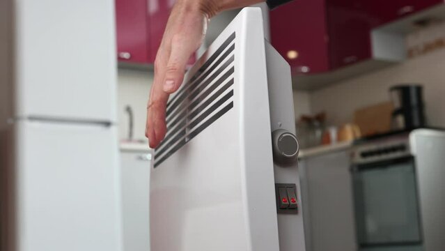  Adjustable heat settings levels of home convector heater, hand rotate thermostat dial. 