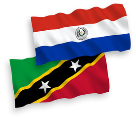 Flags of Federation of Saint Christopher and Nevis and Paraguay on a white background