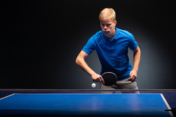 Portrait of young man playing tennis