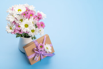 Gift box, Easter eggs and flowers