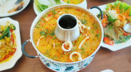 Thai Food Tom Yum Seafood, Tom Yum Kung Creamy spicy soup Hot Pot.