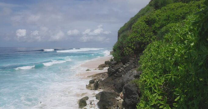 Tropical coastline with rocks and ocean in Bali island
