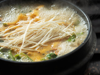 Stew boiling in an earthenware pot
