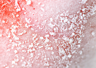 Ice on frozen bell pepper as a background.