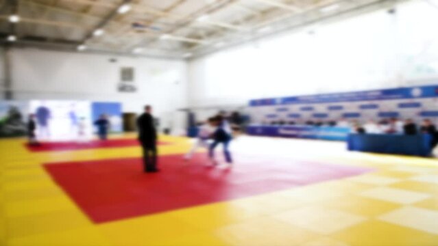 Judo competitions. Young athletes compete on the tatami. Judo. Blurred.