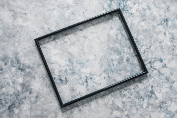 black rectangular picture frame mock-up with copy space for yout text or image on top of grey blue background