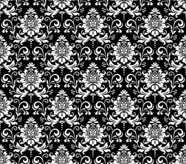 Floral pattern. Vintage wallpaper in the Baroque style. Seamless vector background. White and black ornament for fabric, wallpaper, packaging. Ornate Damask flower ornament