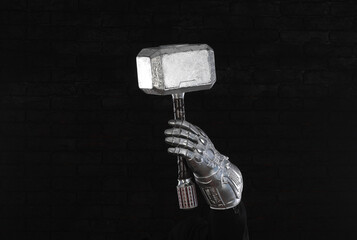 businessman hand holding hammer Thor