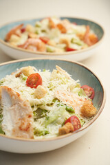 Traditional caesar salad with shrimp and chicken