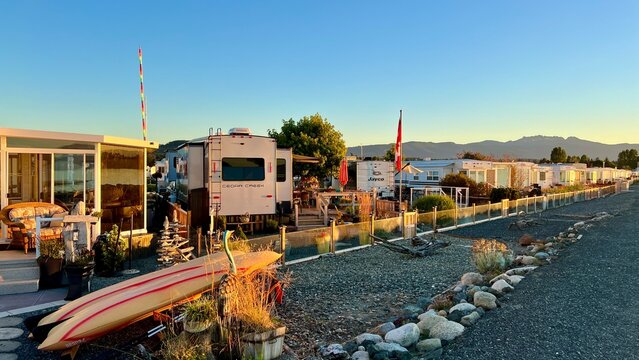 sunset on Ocean Horizon mountains clouds and bright colors slow motion video suitable for music relaxation background For text silence peace Parksville beach Surfside RV resort 08.2022 Canada