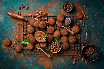 Chocolate Cookies, cocoa powder, chocolate and cocoa beans. Sweets, pastries, brownies On a dark...