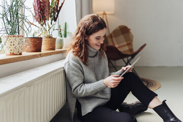 Young Woman Communicating on Digital Tablet - 579275370
