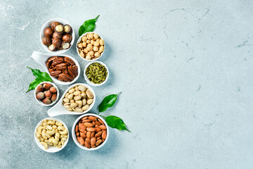 Natural background made from different kinds of nuts. Top view.