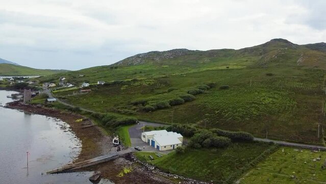 Aerial drone shot of the hills and coast at The life boat station on Achill Sound Achill Island where  the award winning Banshees of Inisherin was filmed