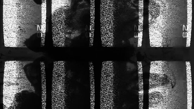 Vertical video. TV glitch screen static noise. Channel interference. Black white grain texture old television set display with dark smoke flow motion.