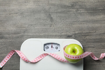 Diet and weight loss, healthy lifestyle, composition with measuring tape, space for text