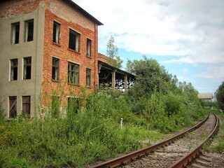Fototapeta na wymiar Old track at an abandoned factory