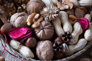 Obraz na płótnie Canvas Beautiful basket of nuts such as walnuts, peanuts, almonds and hazelnuts