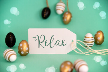 Fototapeta na wymiar Golden Easter Egg Decoration. Label With English Text Relax